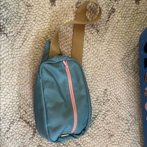 Stylish Blue Crossbody Bag with Pink Accents